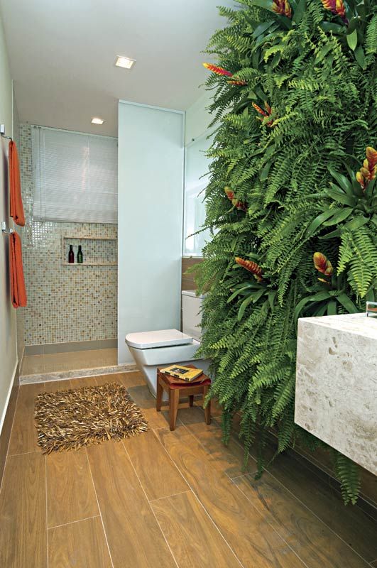 a gorgeous lush fern wall makes a natural statement and takes over the whole space