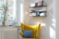 22 a modern take on a classic wingback in sunny yellow is a great base for a reading space