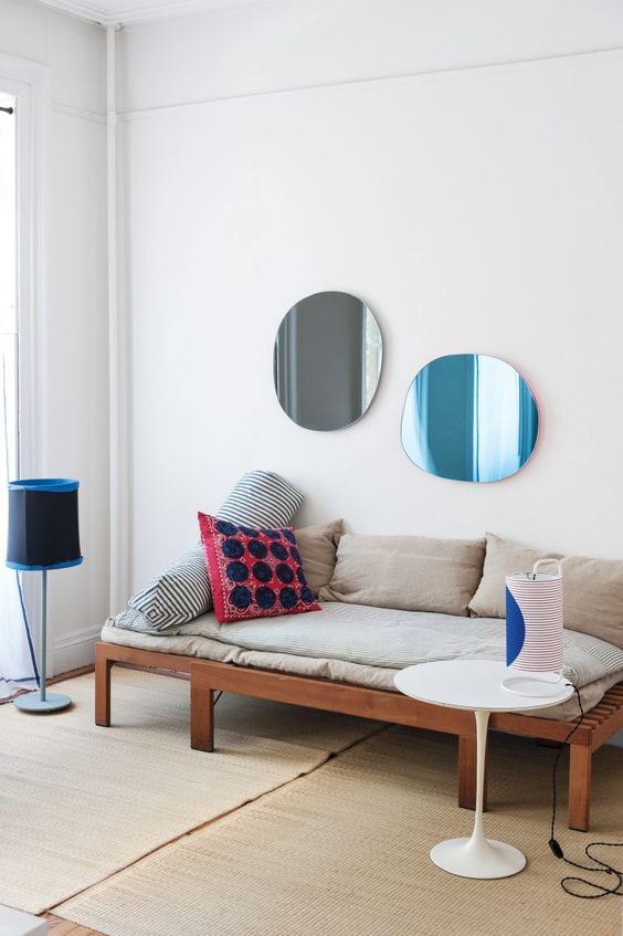 asymmetrical decorative mirrors in different colors - take two for more harmony in your space