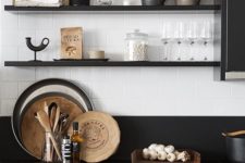 23 black open shelves match the cabinets and countertops but look less bulky