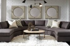 24 a laconic brown rounded sectional sofa is the base of this room, and everything is built around it