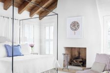 25 a rustic ceiling of weathered wood with beams makes this cozy country-styled bedroom complete