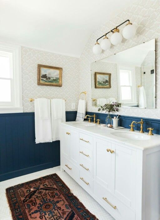 bold blue wainscoting creates a chic contrast and adds a chic touch to the space