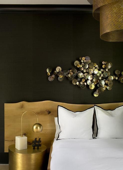 an amazing shiny metal wall sculpture adds a refined touch to the space