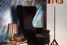 26 an elegant take on a wingback, a black velvet chair with chic lines and shapes