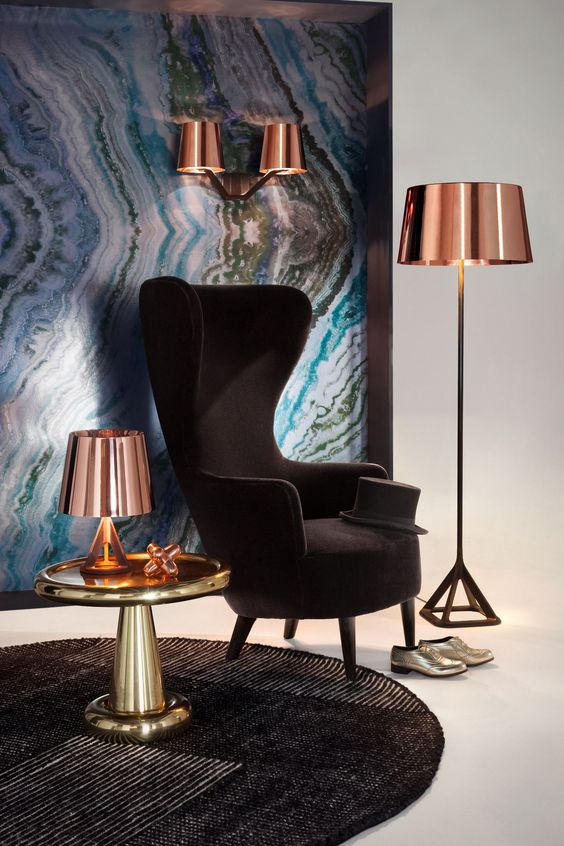 an elegant take on a wingback, a black velvet chair with chic lines and shapes