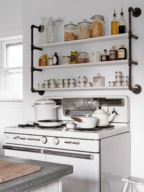 open shelving highlighted with metal tubing of a different color to make it a part of decor