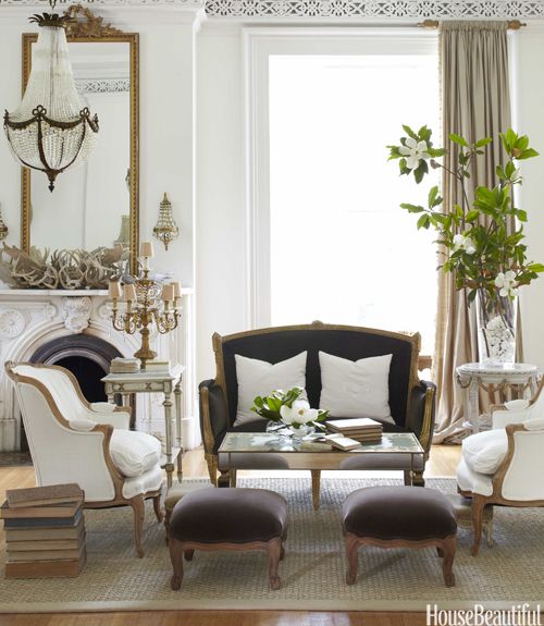 refined vintage upholstered furniture and a matching mirror for a Parisian living room