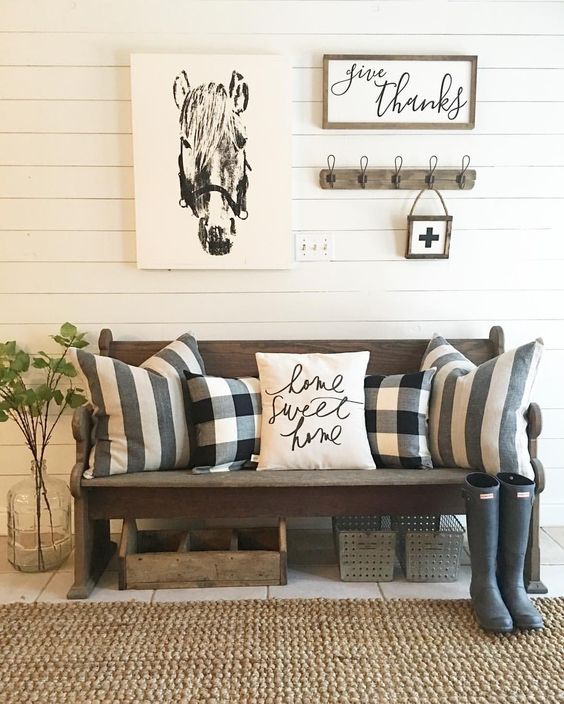 some buffalo check pillows are a great idea to style a rustic entryway