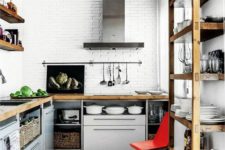 grey kitchen cabinets with metal legs and wooden countertops for a bold and modern kitchen with an industrial feel