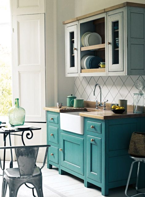 Two toned free standing kitchen cabinets comprise two of the hottest kitchen decor trends in one