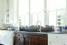 vintage white and dark wood cabinets on legs are used for an eclectic and catchy kitchen look