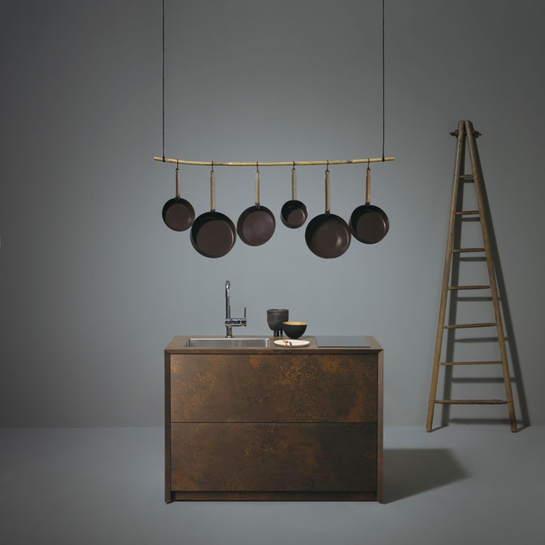 Ceragino kitchen is done with an oxidized metal finish and features an additional shelf