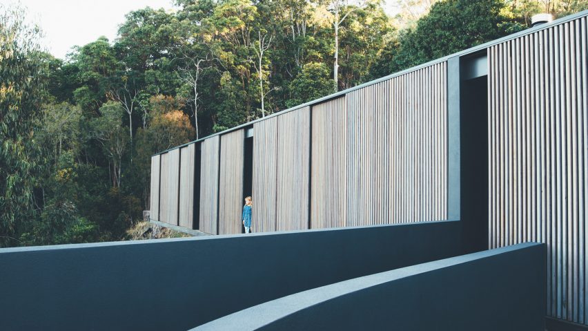 This Australian home is fully clad with timber screens that protect the house from excessive sunlight