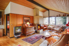 01 This home is mid-century modern, with vintage Danish furniture and much honey-colored wood in decor