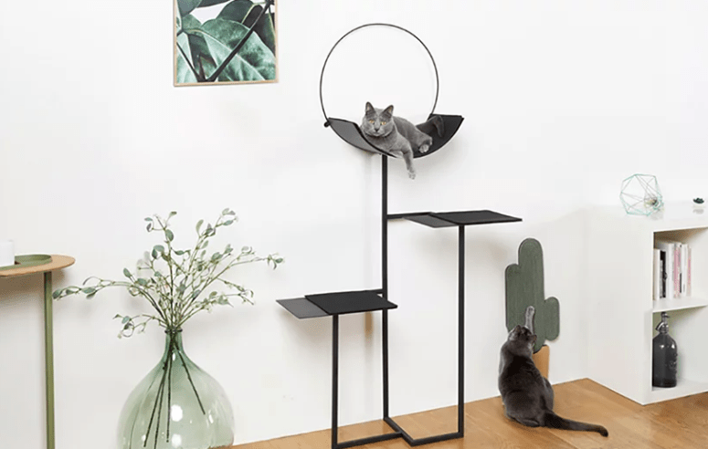 HOOP is a minimalist cat tree or cat bed that consists of three parts including a rounded bed with a circle