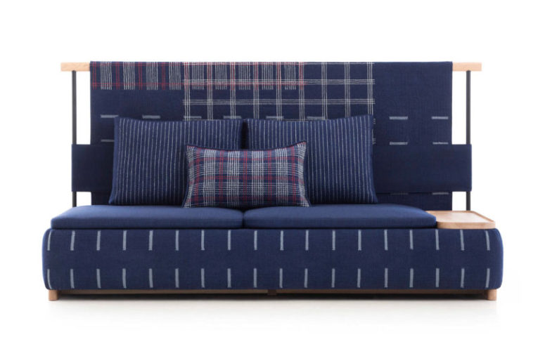 This is a sofa with lots of cushions, plaid prints and a cool look - it's ideal for a modern dynamic space