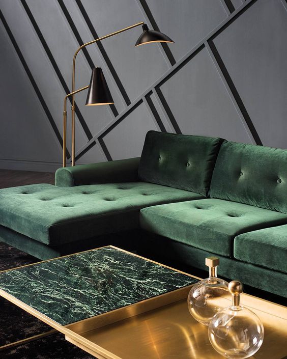 a half brass and half green marble coffee table brings a refined and chic touch to the living room