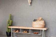 02 a metal shoe rack bench with wire storage compartments and a wooden top for an industrial space