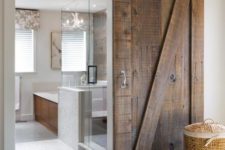 02 a modern space features sliding barn doors of reclaimed wood that make a bold rustic statement