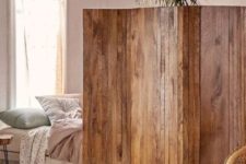 02 a stained reclaimed wooden screens is a cool idea to separate a studio apartment