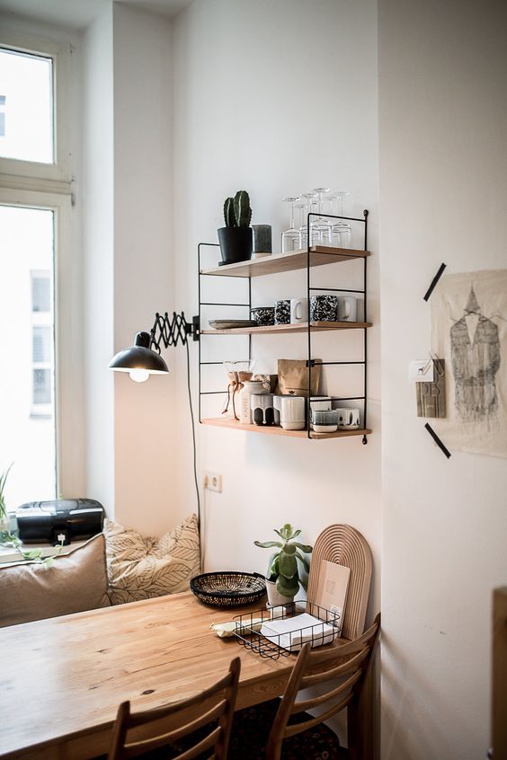 hang an open shelf that matches in over the dining space, it won't look bulky