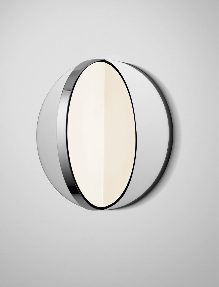 Eclipse is a wall lamp that reminds of Tidal and looks like a real eclipse