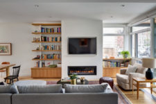 04 A built-in fireplace adds coziness and there’s a comfy reading nook by the window