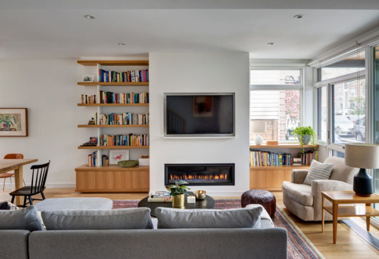 A built-in fireplace adds coziness and there's a comfy reading nook by the window