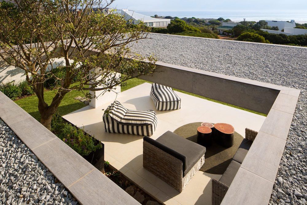 All the outdoor spaces are roofed and framed due to the harsh coastal climate
