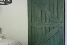 04 a vintage rustic barn door painted green for a textural and colroful statement