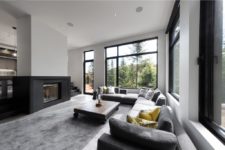 05 The two-sided fireplace adds coziness, and a large corner sofa create a nice conversation pit