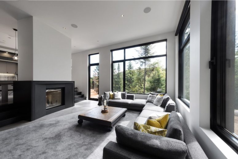 The two-sided fireplace adds coziness, and a large corner sofa create a nice conversation pit