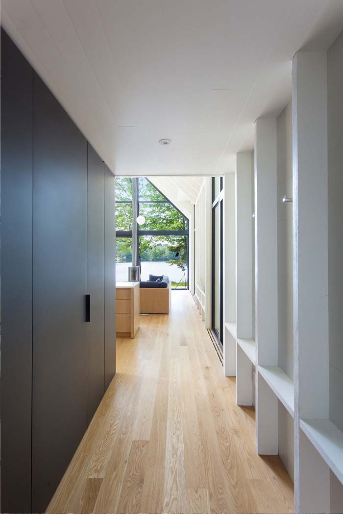 The walls features comfortable shelves, and there are wardrobes lining up the corridor