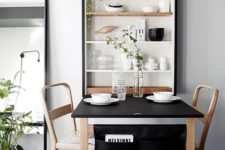 05 a wall shelving unit with a clesed part perfectly matches the dining set and adds to the decor