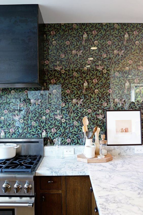 cover the wallpaper with acrylic or glass screens to save the wallpaper from grease and water splashes