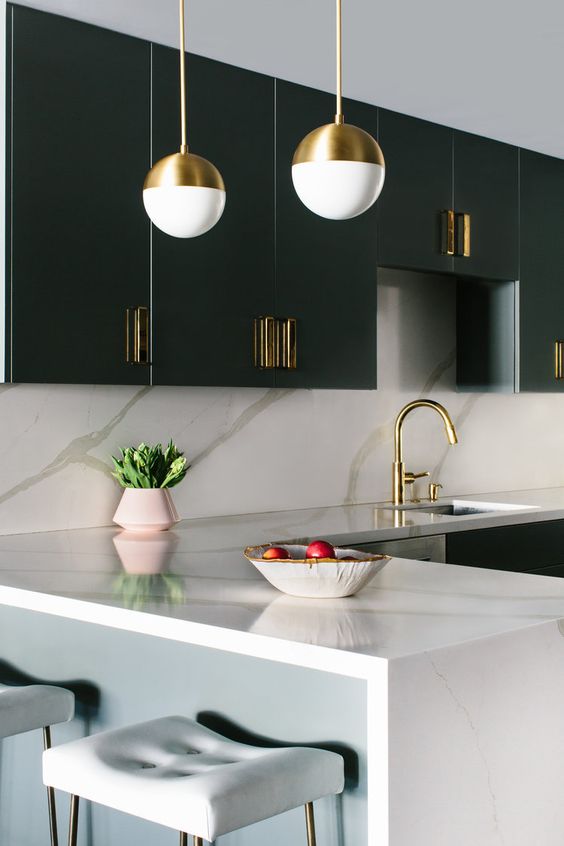 a styligh minimalist kitchen with touches of art deco and chic marble surfaces