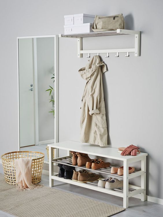 a modern white entryway bench with a double shoe rack is a great ideafor a modern space