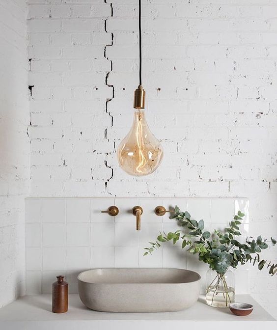 a very cool idea of accent lighting is a large pendant lamp with a brass accent and matching fixtures