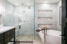 08 The bathroom is clad with marble tiles, there are niches with candles for taking a bath with comfort