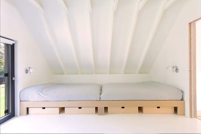 There's an additional sleeping space for guests, with some drawers for storage underneath