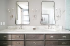 09 You may see a large double vanity, eye-catchy shaped mirrors and creative wall lamps