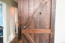 09 add a rustic feel and country charm with rich-colored barn doors to the interiors, even if they aren’t very rustic