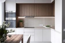 10 a compact kitchen with minimalist aesthetics and touches of natural wood for more coziness