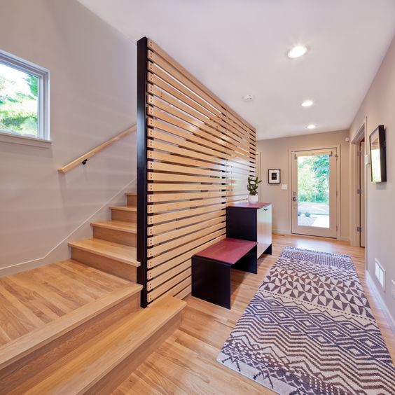 a horizontal wooden plank screen is what you need to avoid a bulky look and make the space airier