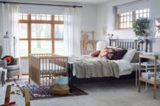 10 a modern bedroom decorated with IKEA furniture and a comfy crib at the bedfoot