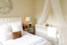11 a modern glam master bedorom with a crib and a canopy by the wall – evena  small space can accomodate what you need