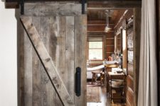 11 a sliding barn door of reclaimed wood is an ideal choice for a woodland or mountain cabin