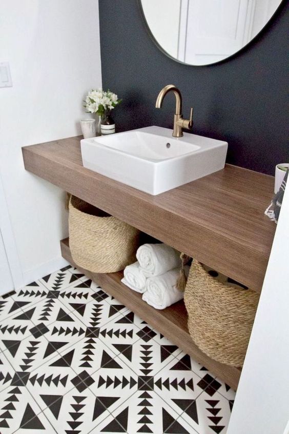 make a double countertop vanity to use the space in between for storage