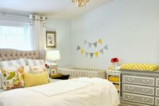 12 a modern farmhouse shared master bedroom and nursery space with a crib and a changing table
